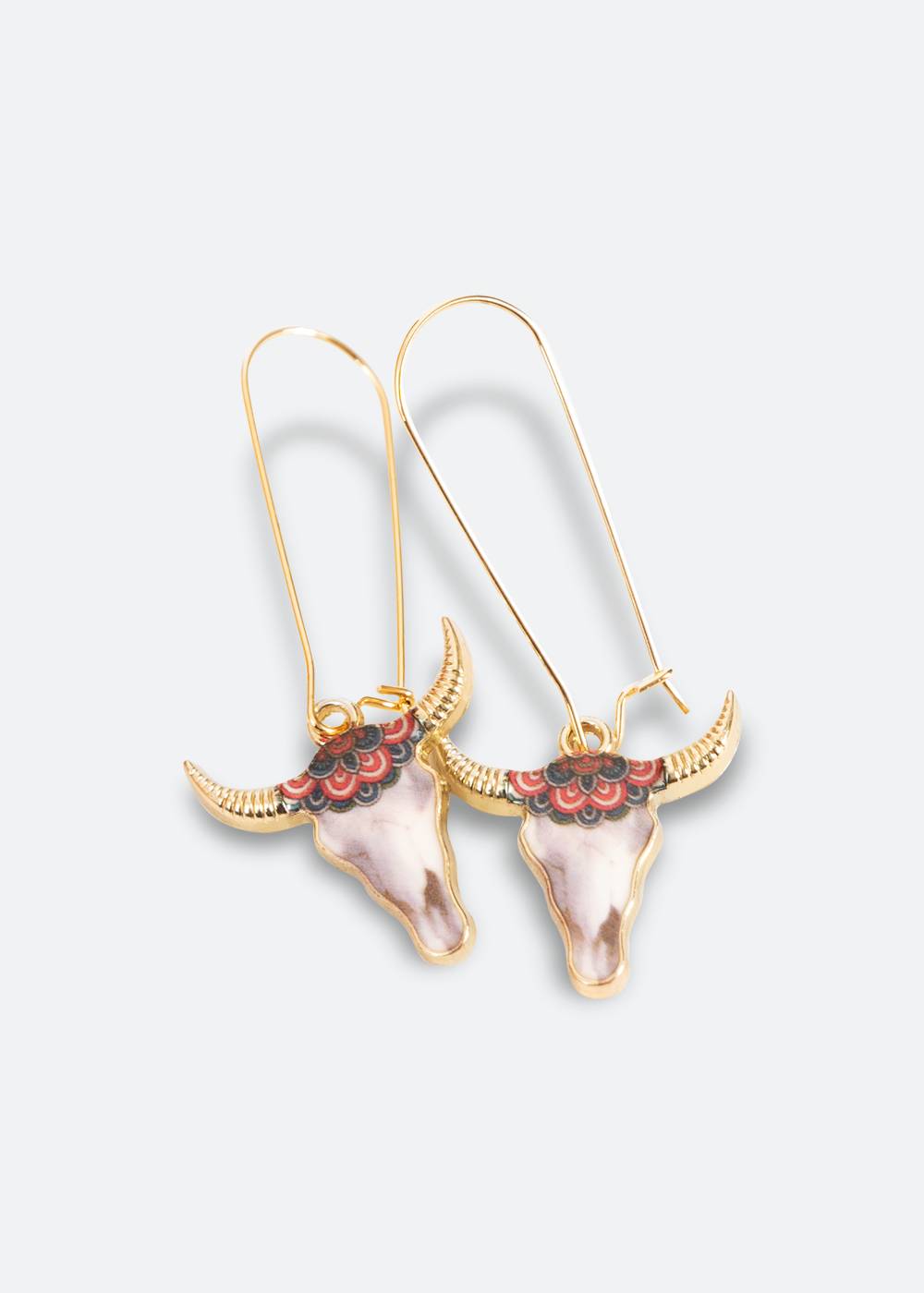 Handcrafted earring in gold color with long hook and horns