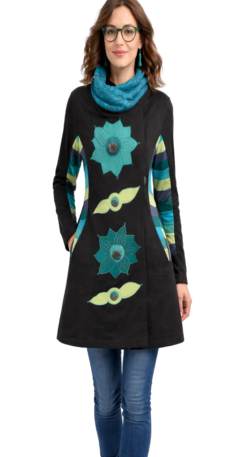 Women wearing Black jacket with teal flowers and stripes down the arms of light green teals and cowl neck collar blue artist jacket 